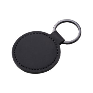 Quaderno con copertina in PU riciclato con fogli a righe (80 pag.) 22 Portachiavi rotondo in soft PU. Con anello in metallo